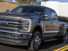2023-ford-super-duty-f-350-drw-dually-lariat-press-photos-exterior-007-front-three-quarters-towing-trailer