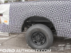 2023-ford-super-duty-xl-crewcab-long-bed-prototype-spy-shots-january-2022-exterior-004-rear-wheel-leaf-springs-exhaust-pipe