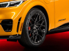 2023-mustang-mach-e-gt-performance-edition-cyber-orange-nite-pony-package-exterior-003-front-three-quarters-pirelli-pzero-nero-tire-high-gloss-black-19-inch-front-wheel-reflector