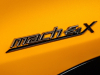 2023-mustang-mach-e-gt-performance-edition-cyber-orange-nite-pony-package-exterior-009-mach-e-4x-logo-badge