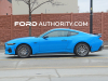 2024-ford-mustang-coupe-gt-grabber-blue-ae-with-optional-wing-spoiler-exterior-004