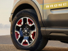 2024-ford-bronco-sport-free-wheeling-edition-press-photos-exterior-008-side-continental-procontact-tire-17-inch-matte-black-painted-wheel-bronco-logo-badge-on-door