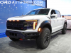 2024-ford-f-150-raptor-r-2023-naias-oxford-white-yz-exterior-002-front-three-quarters-amber-grille-marker-lights-drl-daytime-running-lights-amber-side-marker-light