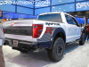 2024-ford-f-150-raptor-r-2023-naias-oxford-white-yz-exterior-003-rear-three-quarters-raptor-r-exterior-theme-on-bedside-exhaust