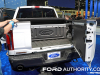 2024-ford-f-150-tremor-oxford-white-yz-2023-naias-exterior-007-rear-pro-access-tailgate-center-panel-open-ford-logo-badge-on-bulkhead-rear-bumper-step-ford-logo-on-bulkhead