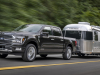 2024-ford-f-150-platinum-press-photos-exterior-007-side-front-three-quarters-towing