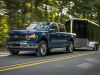 2024-ford-f-150-xlt-press-photos-exterior-005-front-three-quarters-towing