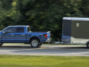 2024-ford-f-150-xlt-press-photos-exterior-006-side-towing