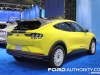 2024-ford-mustang-mach-e-rally-grabber-yellow-2023-naias-exterior-004-side-rear-three-quarters-wing-spoiler