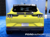 2024-ford-mustang-mach-e-rally-grabber-yellow-2023-naias-exterior-005-rear-tail-lights-wing-spoiler