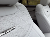 2025-ford-explorer-platinum-press-photos-interior-008-front-seat-detail-platinum-logo-badge-on-seat
