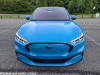 2021-ford-mustang-mach-e-first-edition-grabber-blue-fa-garage-exterior-001-front