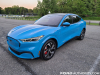 2021-ford-mustang-mach-e-first-edition-grabber-blue-fa-garage-exterior-002-front-three-quarters