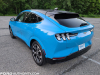 2021-ford-mustang-mach-e-first-edition-grabber-blue-fa-garage-exterior-004-rear-three-quarters