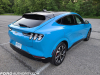 2021-ford-mustang-mach-e-first-edition-grabber-blue-fa-garage-exterior-006-rear-three-quarters