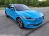 2021-ford-mustang-mach-e-first-edition-grabber-blue-fa-garage-exterior-008-front-three-quarters