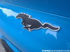 2021-ford-mustang-mach-e-first-edition-grabber-blue-fa-garage-exterior-014-black-mustang-pony-logo-rear-liftgate