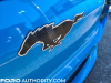 2021-ford-mustang-mach-e-first-edition-grabber-blue-fa-garage-exterior-024-front-black-mustang-logo-running-pony-grille