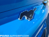 2021-ford-mustang-mach-e-first-edition-grabber-blue-fa-garage-exterior-026-rear-black-mustang-logo-running-pony-liftgate