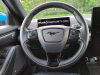 2021-ford-mustang-mach-e-first-edition-grabber-blue-fa-garage-interior-006-cockpit-steering-wheel-digital-gauge-cluster-instrument-panel