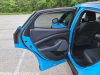 2021-ford-mustang-mach-e-first-edition-grabber-blue-fa-garage-interior-018-driver-side-rear-door