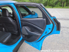 2021-ford-mustang-mach-e-first-edition-grabber-blue-fa-garage-interior-020-passenger-side-rear-door