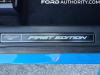 2021-ford-mustang-mach-e-first-edition-grabber-blue-fa-garage-interior-025-first-edition-logo-badge-front-sill