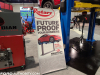 2021-ford-mustang-mach-e-on-lift-2021-sema-live-photos-001-rotary-lift-poster