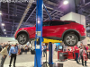 2021-ford-mustang-mach-e-on-lift-2021-sema-live-photos-003-vehicle-on-lift-side