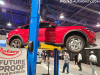 2021-ford-mustang-mach-e-on-lift-2021-sema-live-photos-004-vehicle-on-lift-side
