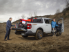 2023-ford-maverick-tremor-press-photos-exterior-012-off-road-rear-three-quarters-dirt-bike-loaded-into-bed-tailgate-adjusted-position