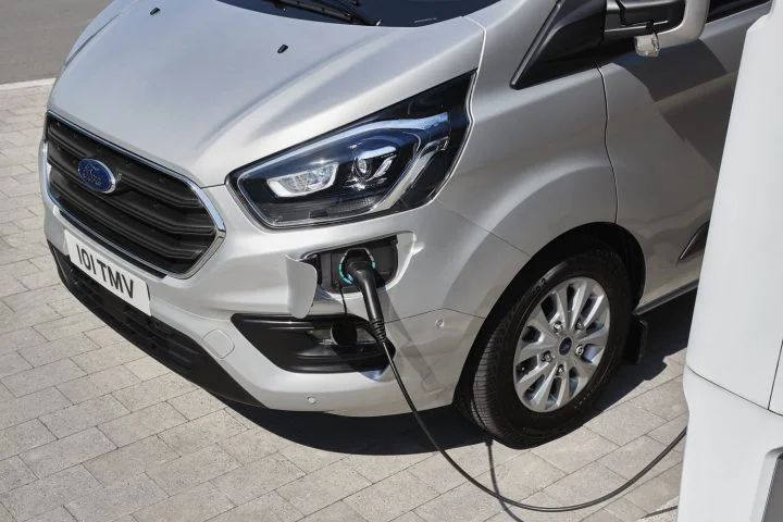 A photo showing the exterior of the Ford Transit Custom PHEV from a front three quarters angle.