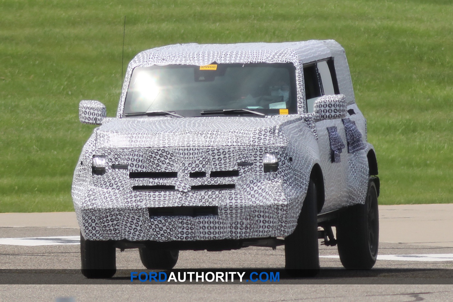 production 2021 ford bronco spotted sitting covered on