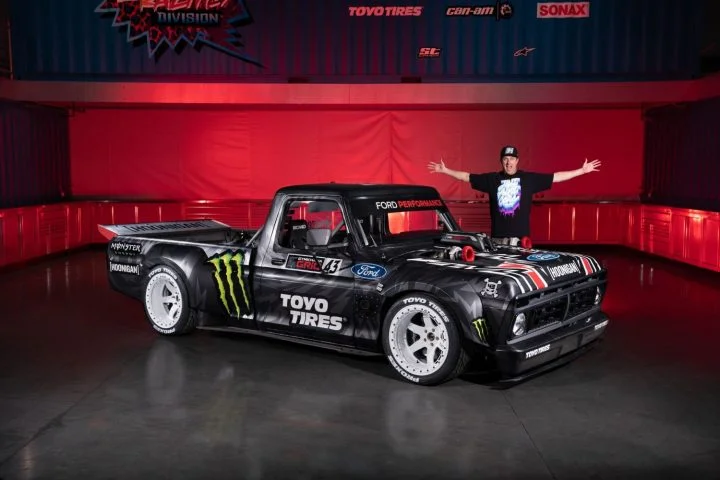Photo of the 1977 Ford F-150 "Hoonitruck," viewed from a front three-quarters angle. This is one of three Ken Block racers on display at the Petersen Museum.
