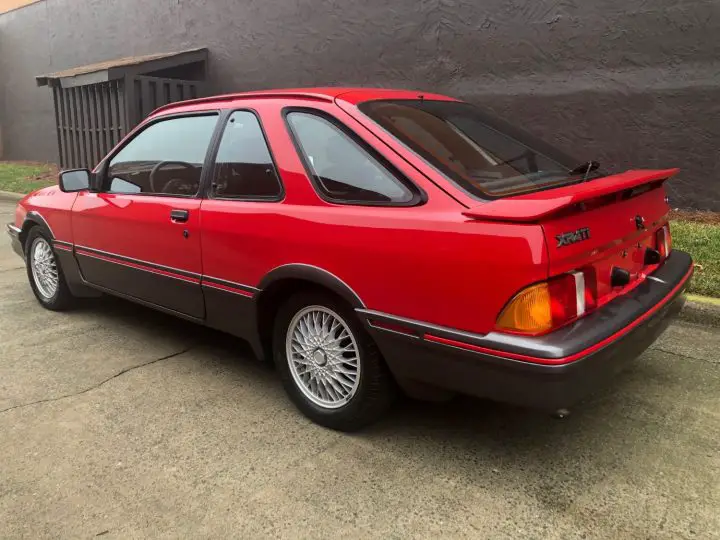 A photo showing the exterior of the 1988 Merkur XR4Ti from a rear three quarters angle.