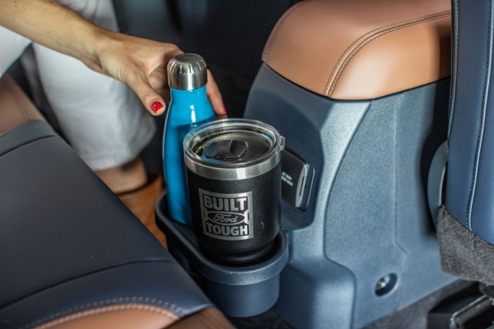 A photo of the FITS cupholder system, which replaces the armrest with integrated cupholders in the 2026 Ford Maverick XLT.