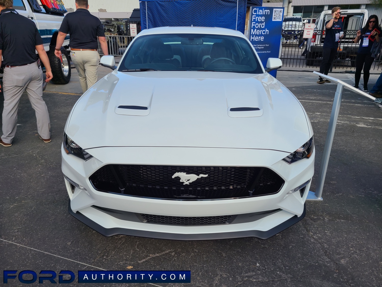 https://fordauthority.com/wp-content/uploads/2021/12/2022-Ford-Mustang-GT-Premium-Ice-White-Edition-Apperance-Package-2021-SEMA-Live-Photos-Exterior-001-front-Oxford-White-Mustang-logo-on-grille.jpg