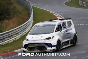 Ford Pro Electric SuperVan on the race track, front three quarters view