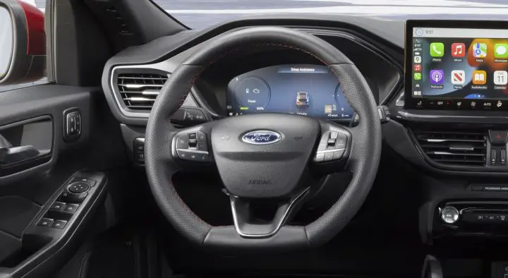 A photo showing the interior of the Ford Escape from the driver's position.