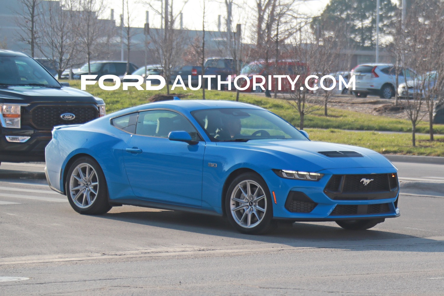 2024 Ford Mustang Coupe GT Grabber Blue Metallic AE Exterior 002 