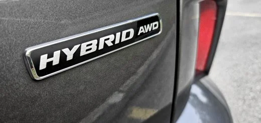 A photo showing the exterior of a 2023 Ford Escape Hybrid decklid badge.