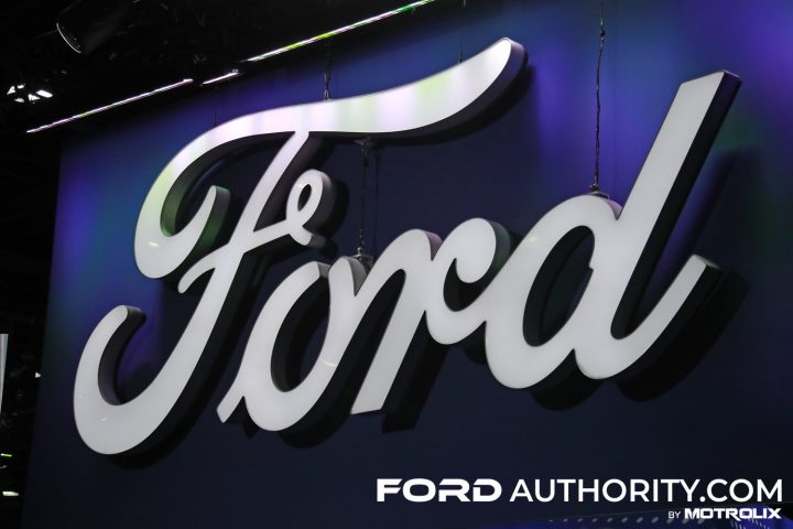 Photo of the Ford logo on display at the 2023 NAIAS show. Fans of Charli XCX see something different when the logo is reversed.