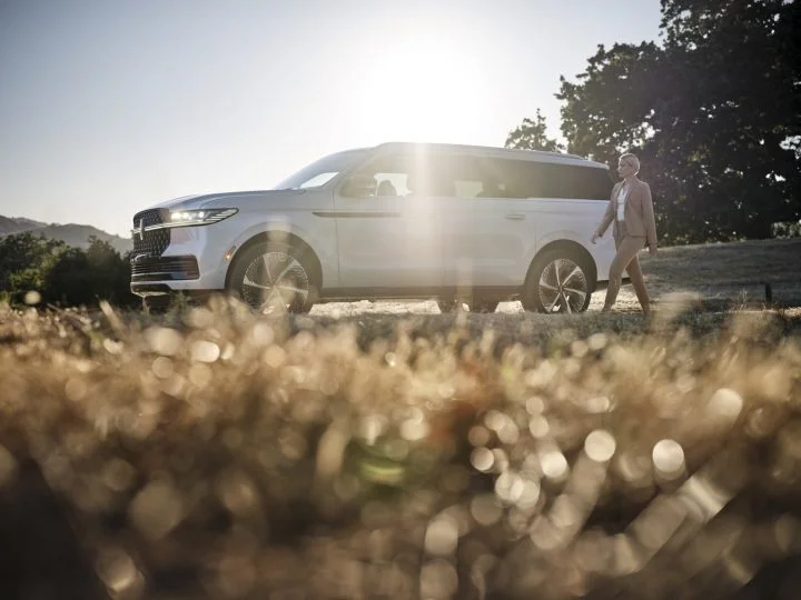 A side view of the 2025 Lincoln Navigator. The luxury SUV features a high-end audio system by Revel as standard.