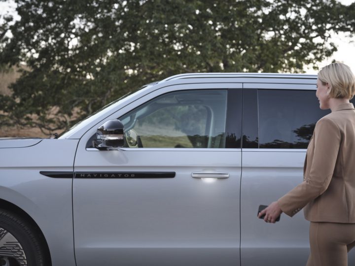 Closeup view of driver side of 2025 Lincoln Navigator L Black Label showing door handle entry light. Lincoln Navigator sales leapt 115 Percent to place second in segment during Q2 2025.