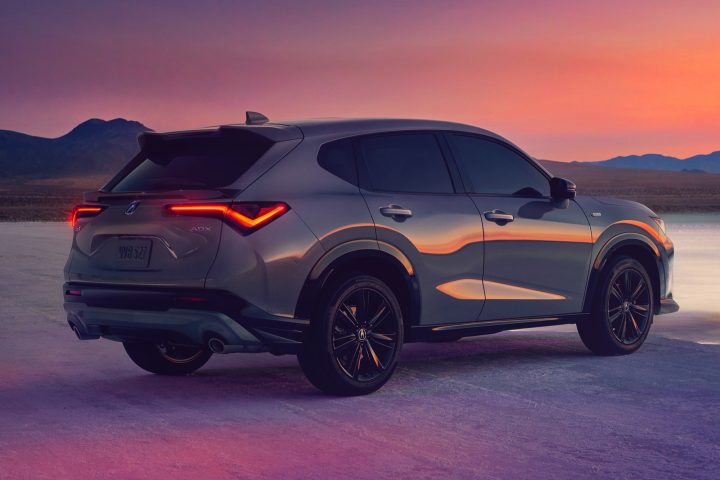 A photo showing the exterior of the 2025 Acura MDX from a rear three quarters angle.
