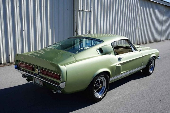 A photo showing the exterior of a 1967 Ford Mustang Shelby GT500 from a rear three quarters angle.