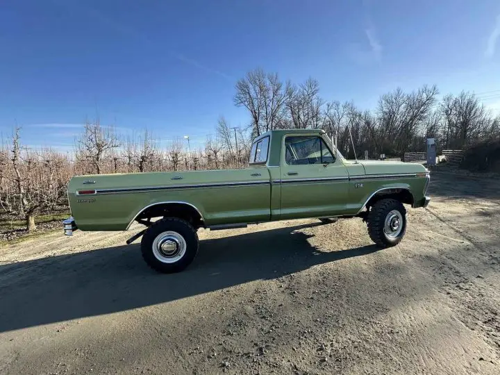 A photo showing the exterior of a 1976 Ford F-250 from a rear three quarters angle.