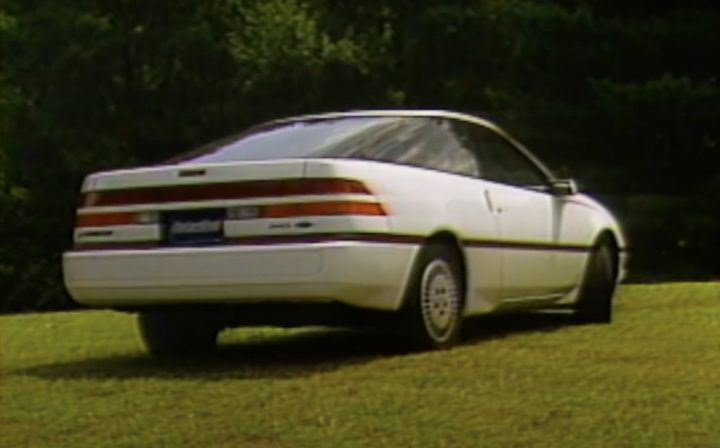 A photo showing the exterior of the 1989 Ford Probe LX from a rear three quarters angle.