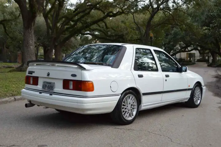 A photo showing the exterior of a 1989 Ford Sierra RS Cosworth from a rear three quarters angle.