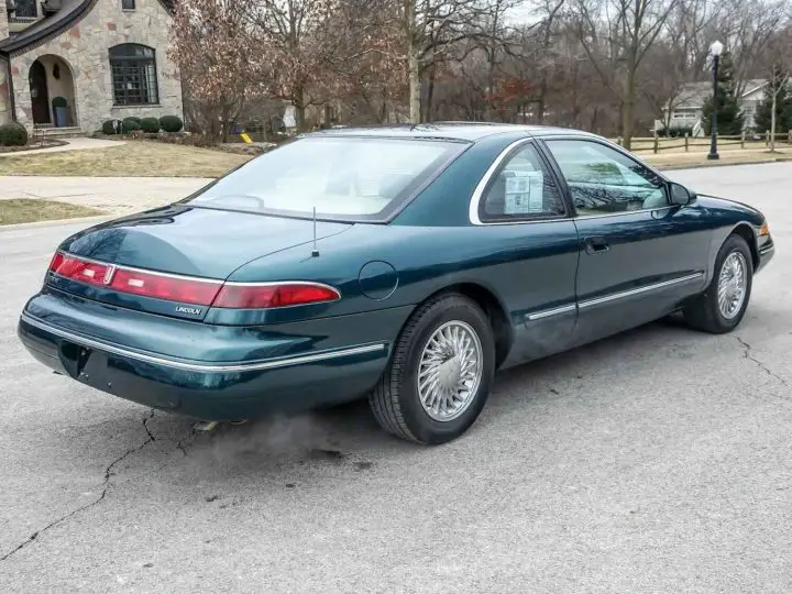 A photo showing the exterior of a 1994 Lincoln Mark VIII from a rear three quarters angle.